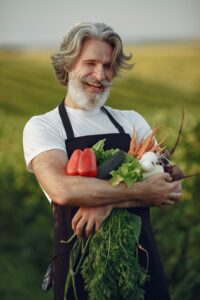 Mike's Garden Harvest - 16 Week Veggie Share - photo of veggie man in field